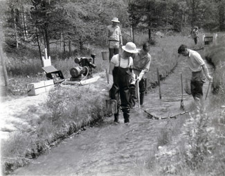 Workers test a stream shocker in this undated photo.