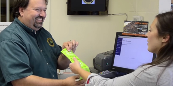 Woman buying a hunting license