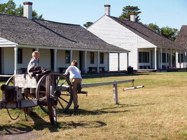 Two children enjoy the cannon at Fort Wilkins Historic State Park in Keweenaw County.