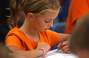 girl taking hunter safety exam