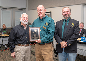 John Niewoonder receiving award, with DNR's Mason and SCI's Taylor