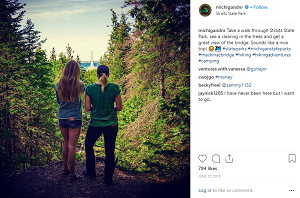 Photo of two girls looking out over the forest in Straits State Park, from Michigan DNR's instagram page