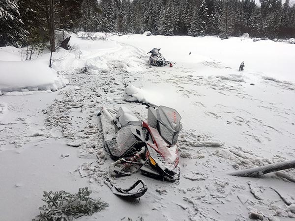 Snowmobiles fallen through the ice on Clyde Lake in Alger County.