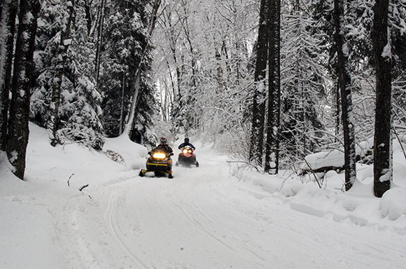 Snowmobilers enjoy a beautiful ride Wednesday afternoon along Trail No. 8 in Marquette County.