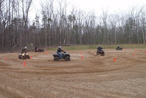 ORV riders practice on a circular cone course