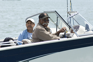 two men on motorized boat