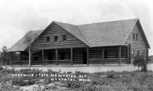 Historic black and white photo of exterior of the Hartwick Pines Memorial Building, c. 1929.