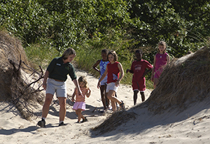 DNR staffer leads kids on a sand dune walk at Hoffmaster State Park