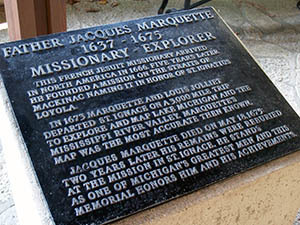 A marker honors Father Jacques Marquette at the national memorial site in Mackinac County.