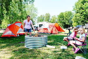 campers tending the fire