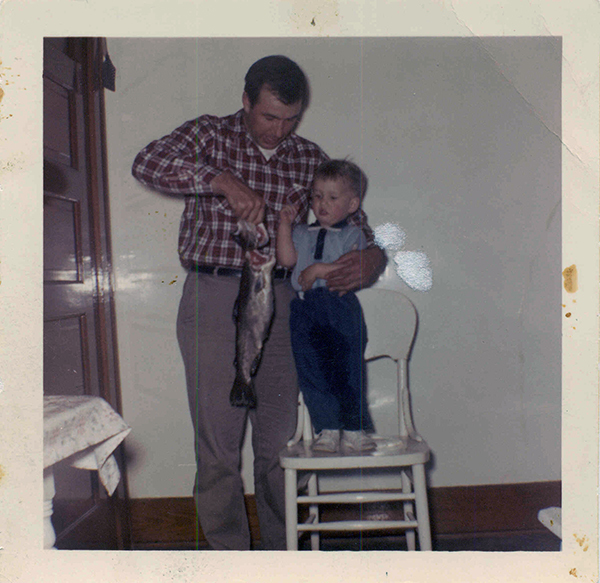 A snapshot from May 1963 showing the author at 2 years old with his dad and a 19-inch brown trout.