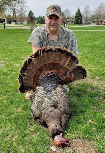 John Murphy showing off his harvested turkey. 