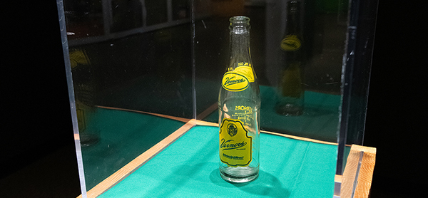 old Vernor's soda bottle in glass display case