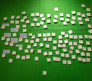 a display of Post-it notes with questions and answers about museum exhibit