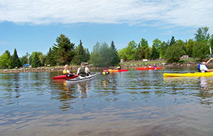 kayakers on the waters of Lake Superior at Baraga State Park