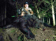 Image of John Murphy with harvested bear.