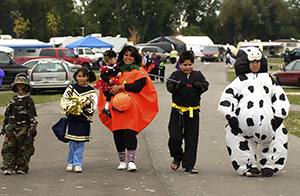 Family in costumes at state park fall festival