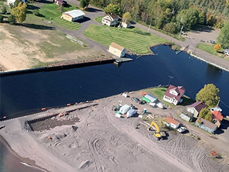 An aerial view shows the Traverse River and stamp sand and natural beaches in the area.