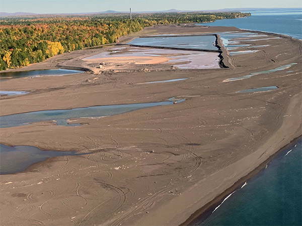 Stamp sands are shown in an aerial photo along the Lake Superior shoreline south of Gay.