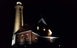 Tawas Point Lighthouse lit up in the dark