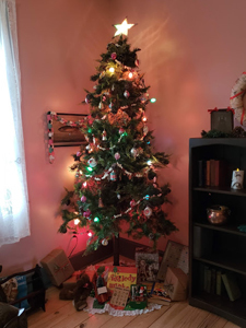 Interior of Tawas Point lighthouse with decorated Christmas tree.