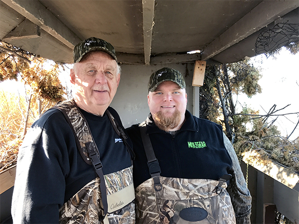 DNR wildlife biologist Ryan Soulard, right, and his father enjoys their first duck hunt together on Saginaw Bay.