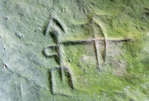 a carving at Sanilac Petroglyphs, of a person with a bow and arrow