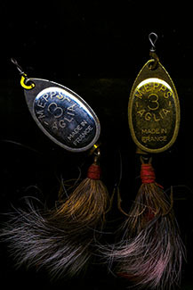 Two fishing lures with squirrel-tail dressing are shown.