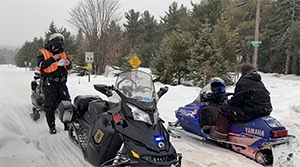 Conservation officer snowmobile patrol