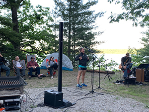 woman telling story at campfire storytelling event