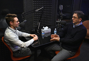 Archives staffers talk in recording booth