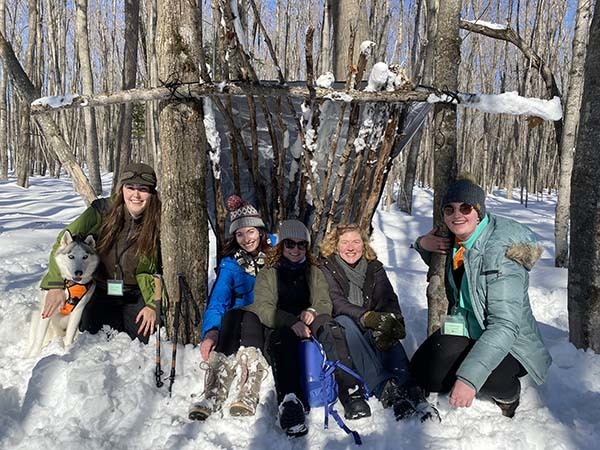 A shelter-building class from the Becoming an Outdoors Woman workshop in February in the Upper Peninsula.