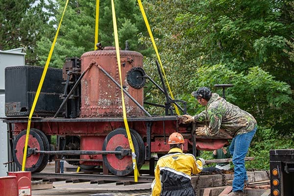 The Yankee locomotive is set into place on a truck today for transport to Pennsylvania.
