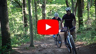 A video link play button to a mountain biking video.