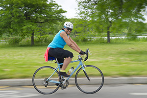 woman biking on Belle Isle