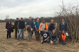 group of park stewardship volunteers in a field