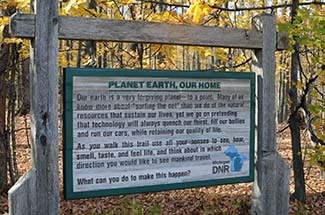 An inscription is shown on a sign near the DNR field office in Crystal Falls.