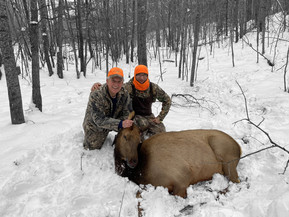 Brent Tackett and Mike Krupnek with an elk