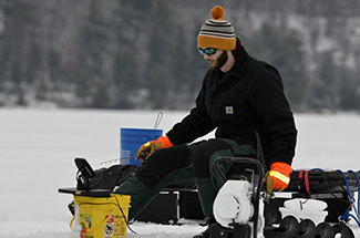 An angler enjoys a winter morning on an Upper Peninsula lake.