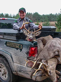 Sgt. Bobbi Lively is pictured with dead deer confiscated by officers.