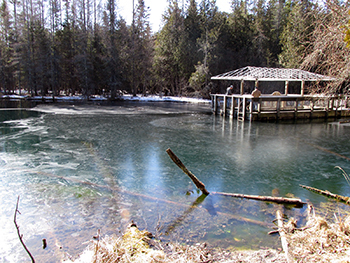 Ice locks in the raft and coats the surface of The Big Spring at Palms Book State Park in Schoolcraft County.