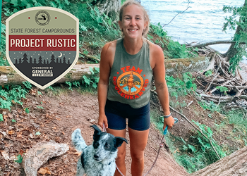 Paige posing with her dog with water in background, Project Rustic logo