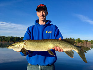 Angler holding a muskellunge