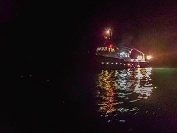 The Survey Vessel Steelhead shown on the water at night over the Good Harbor Reef in 2020.