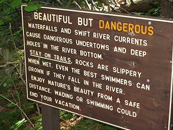 A sign at Porcupine Mountains Wilderness State Park warns of dangers