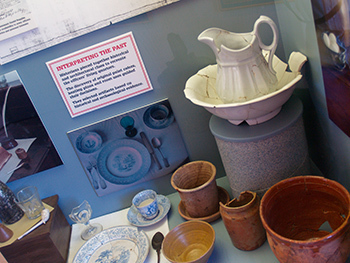 A display of artifacts from the officers' quarters is shown at Fort Wilkins.