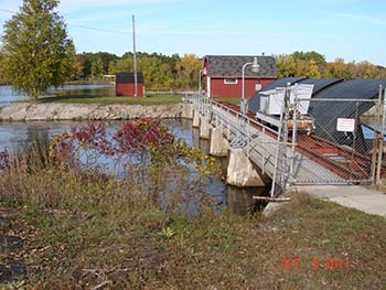 A photo of the Park Mill Dam on the Menominee River is shown.