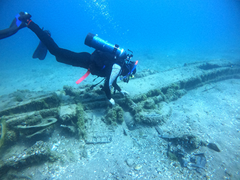 A diver explores the wreckage of the crashed Airacobra in Lake Huron.