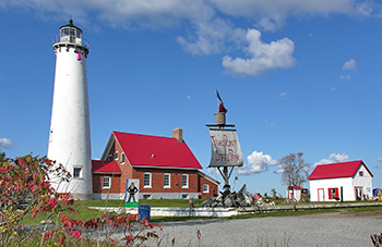 Tawas Point Lighthouse with pirate ship decorations in front
