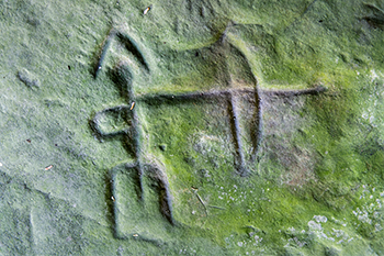 A close-up image of a petroglyph from the Sanilac collection is shown.